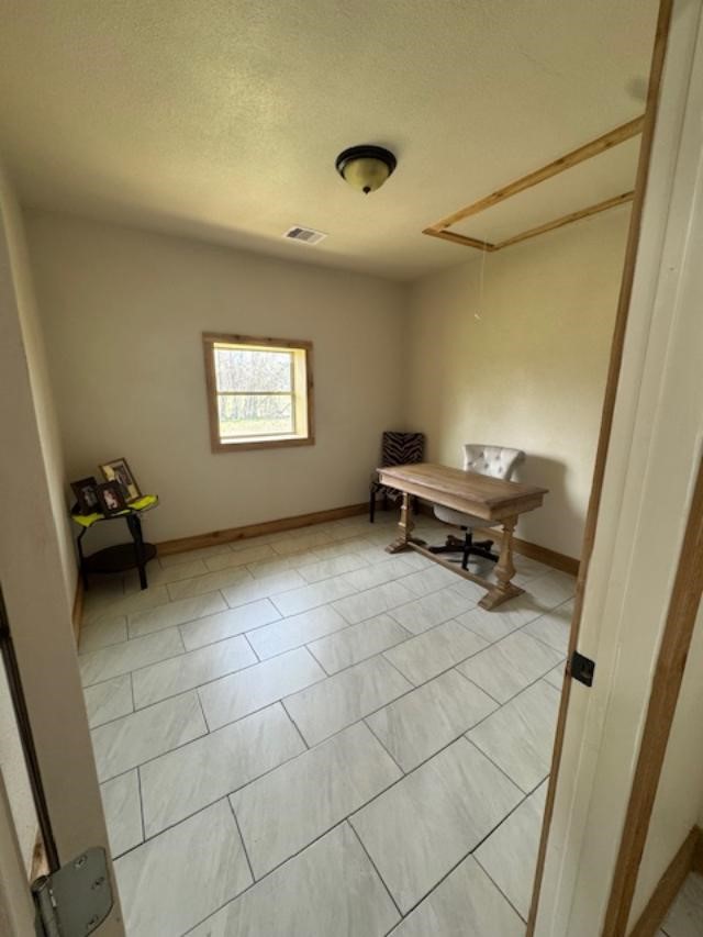 9500 Bissell Road Manvel, TX 77578 - Photo 8 of 14 a view of a workspace with furniture and a window