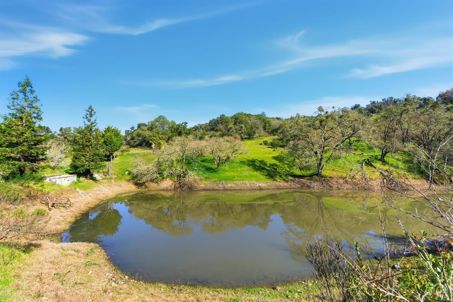 1477 Leslie Road Healdsburg, CA 95448 - Photo 14 of 40 a view of a lake from a yard