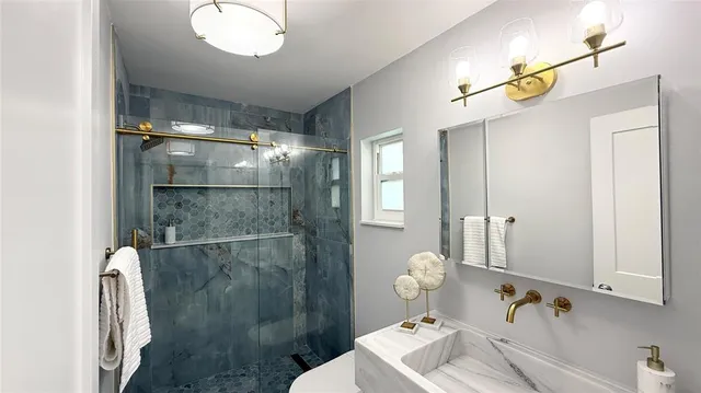 a bathroom with a sink and mirror