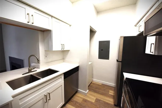 a view of a kitchen with a sink
