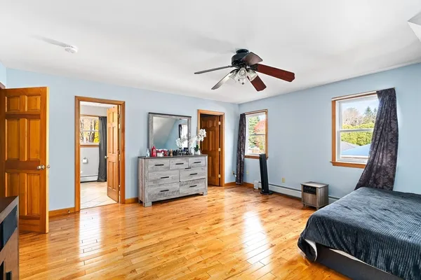 a bedroom with furniture and window