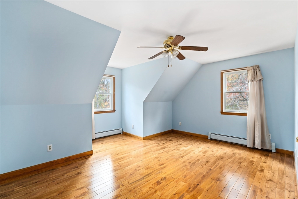 1 Plain Street Easthampton, MA 01027 - Photo 28 of 41 a view of a big room with wooden floor ceiling fan and windows