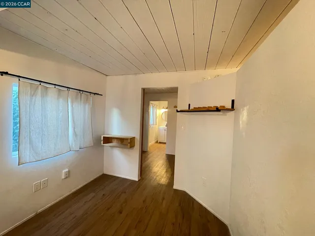 a bedroom with a bed and a shower