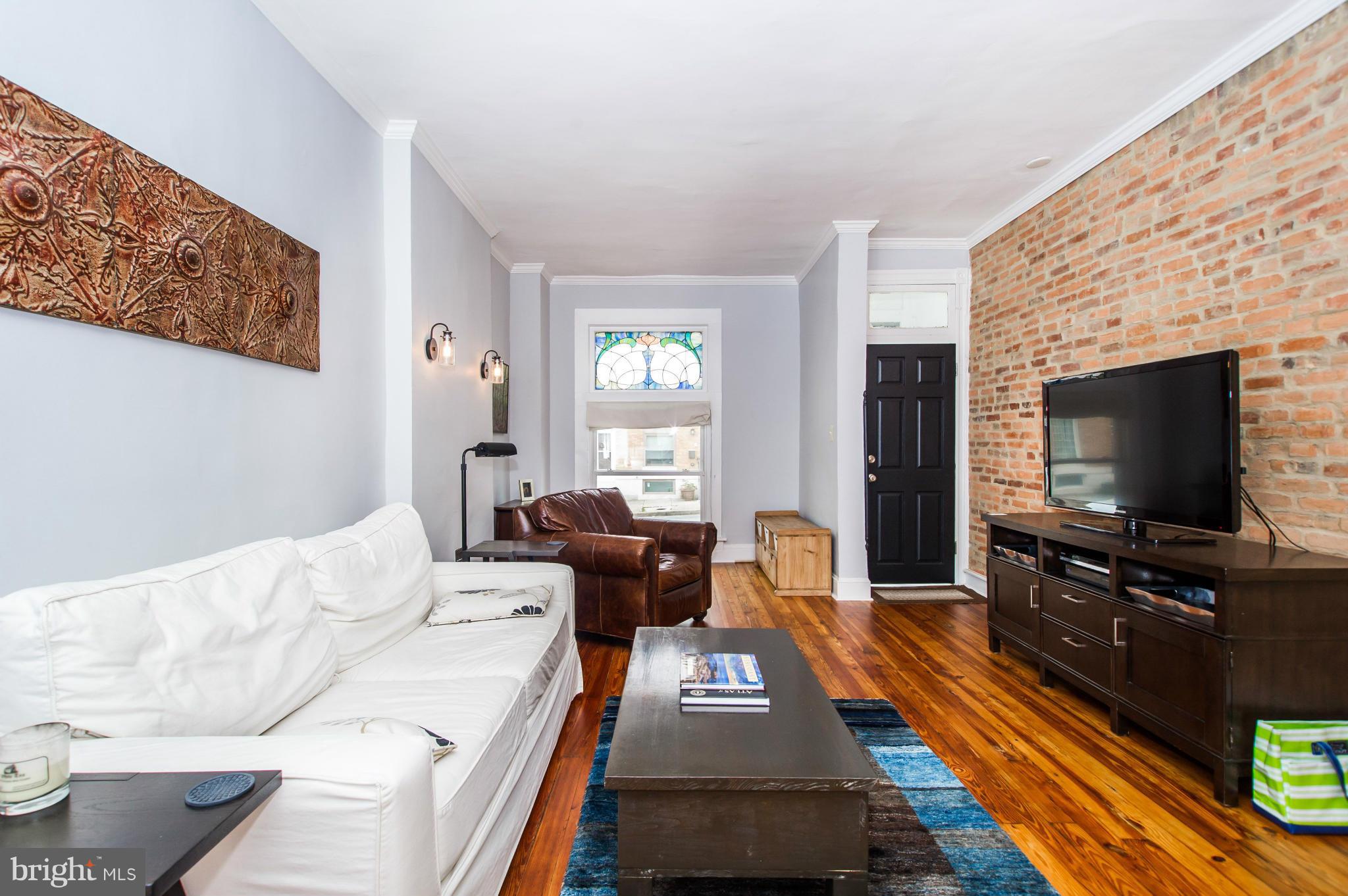 620 South Potomac Street Baltimore, MD 21224 - Photo 5 of 29 Living Room with Exposed Brick