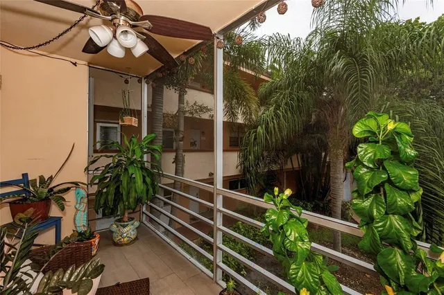 a view of a house with a flower garden