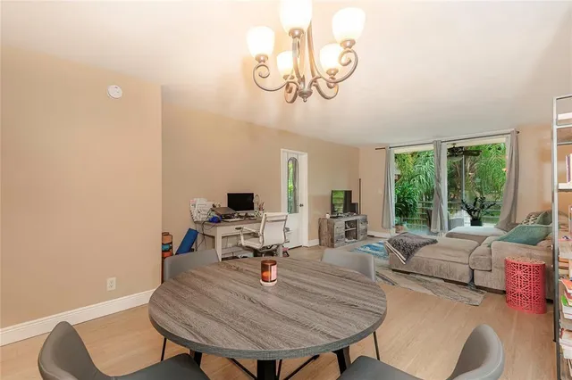 a view of a livingroom with furniture and a window