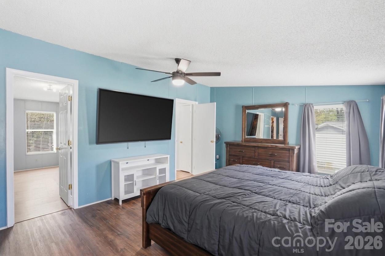605 Ridgewood Court Mount Holly, NC 28120 - Photo 8 of 32 a bedroom with a bed and a flat screen tv