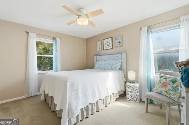 a view of a chair and tables in the backyard