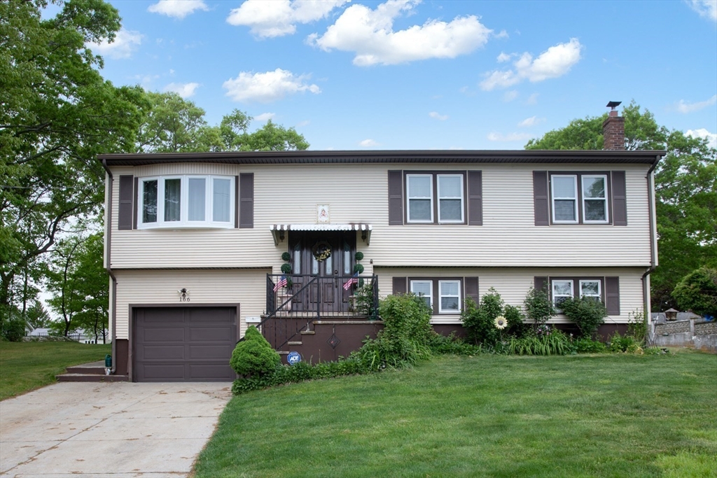 166 Stonehaven Road Fall River, MA 02723 - Photo 1 of 33 a front view of a house with a garden and yard