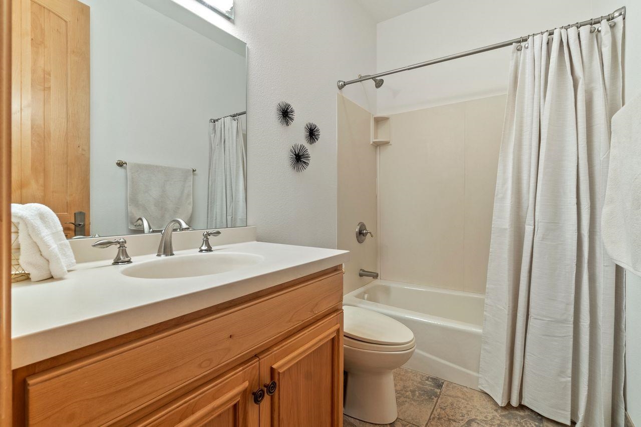 759 Red Sky Clio, CA 96106 - Photo 14 of 21 a bathroom with a granite countertop sink toilet and shower