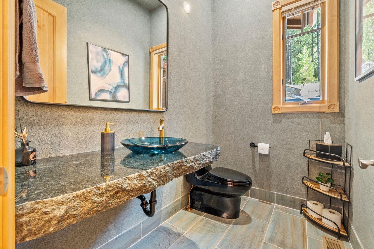 759 Red Sky Clio, CA 96106 - Photo 15 of 21 a bathroom with a granite countertop sink and a mirror