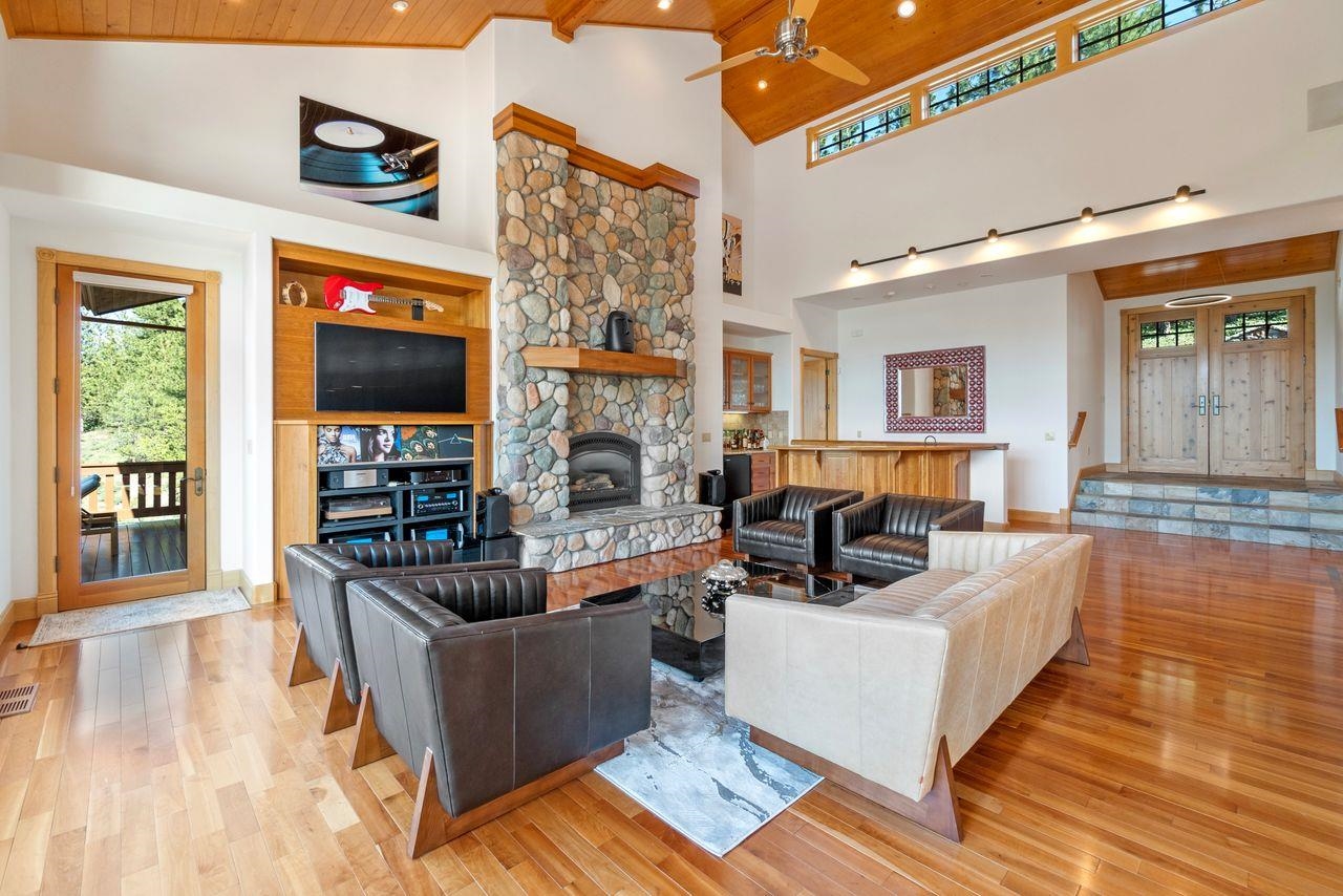 759 Red Sky Clio, CA 96106 - Photo 3 of 21 a living room with fireplace furniture and a wooden floor