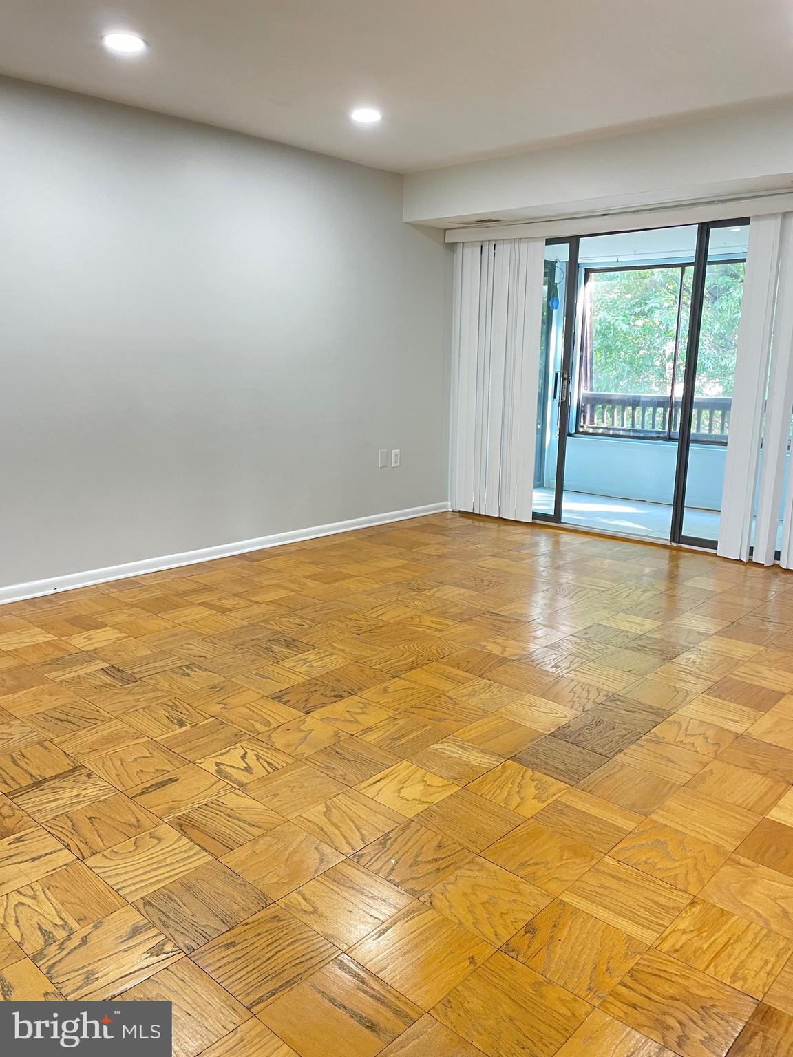 5234 West Running Brook Road, Unit 301 Columbia, MD 21044 - Photo 1 of 13 a view of an empty room with glass door
