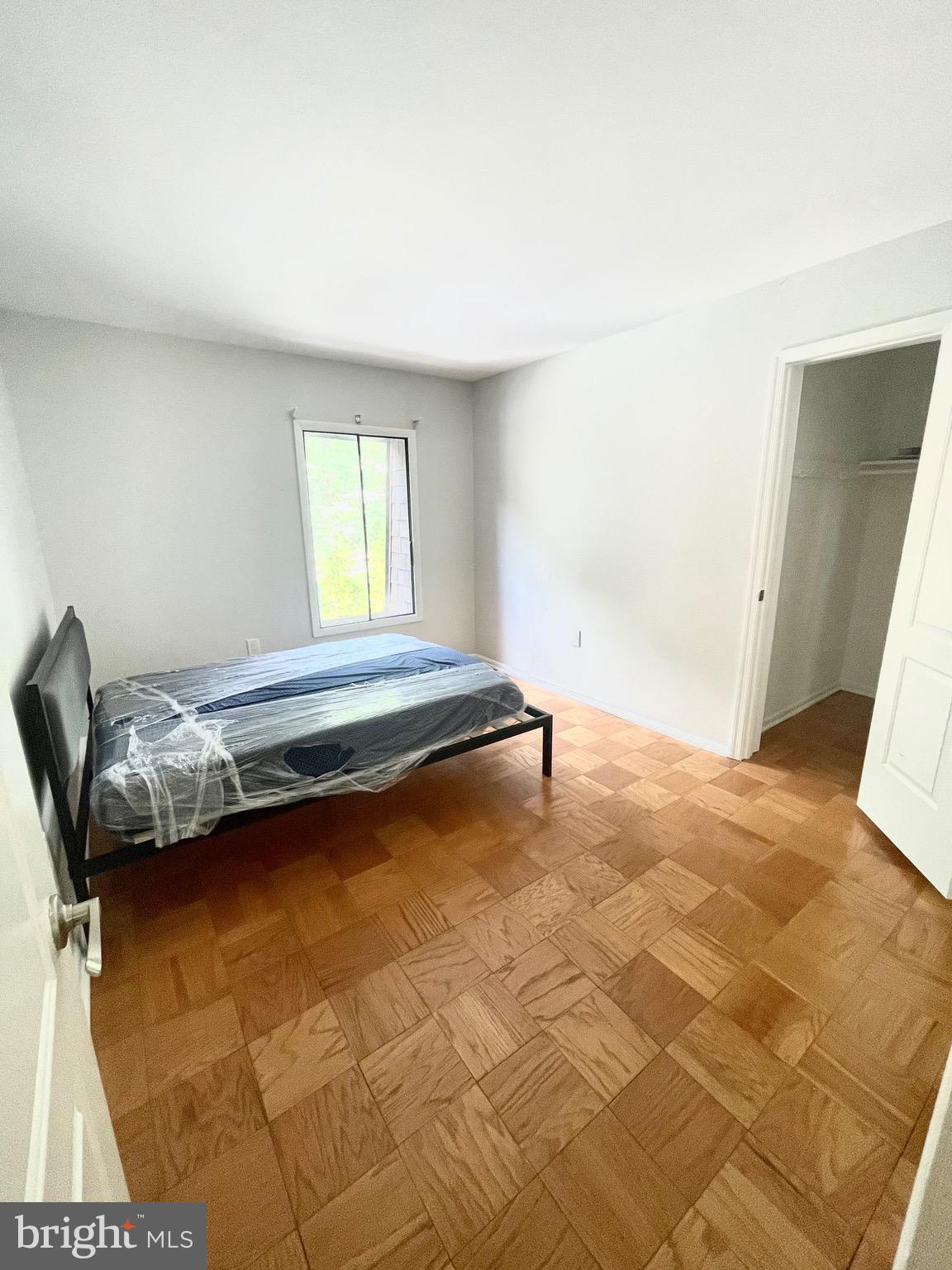 5234 West Running Brook Road, Unit 301 Columbia, MD 21044 - Photo 11 of 13 a bedroom with a bed and a window in it