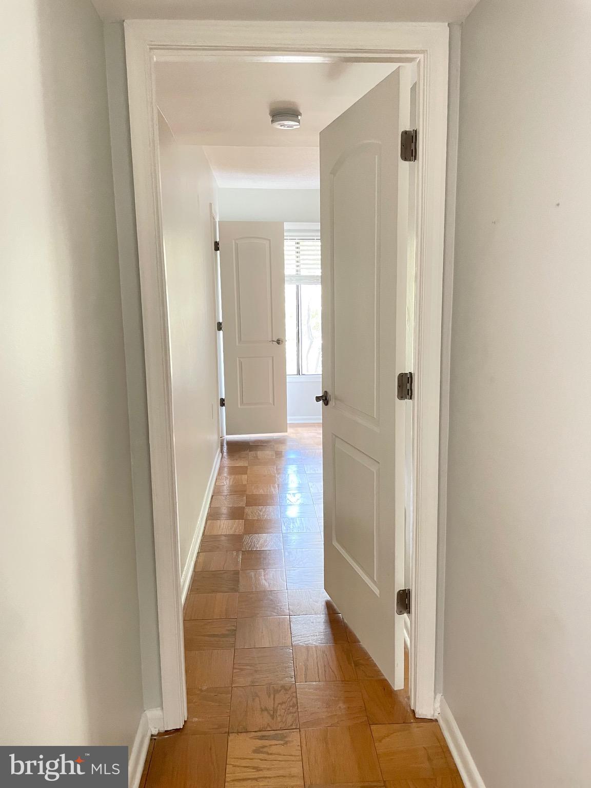 5234 West Running Brook Road, Unit 301 Columbia, MD 21044 - Photo 2 of 13 a view of a hallway with a wooden floor