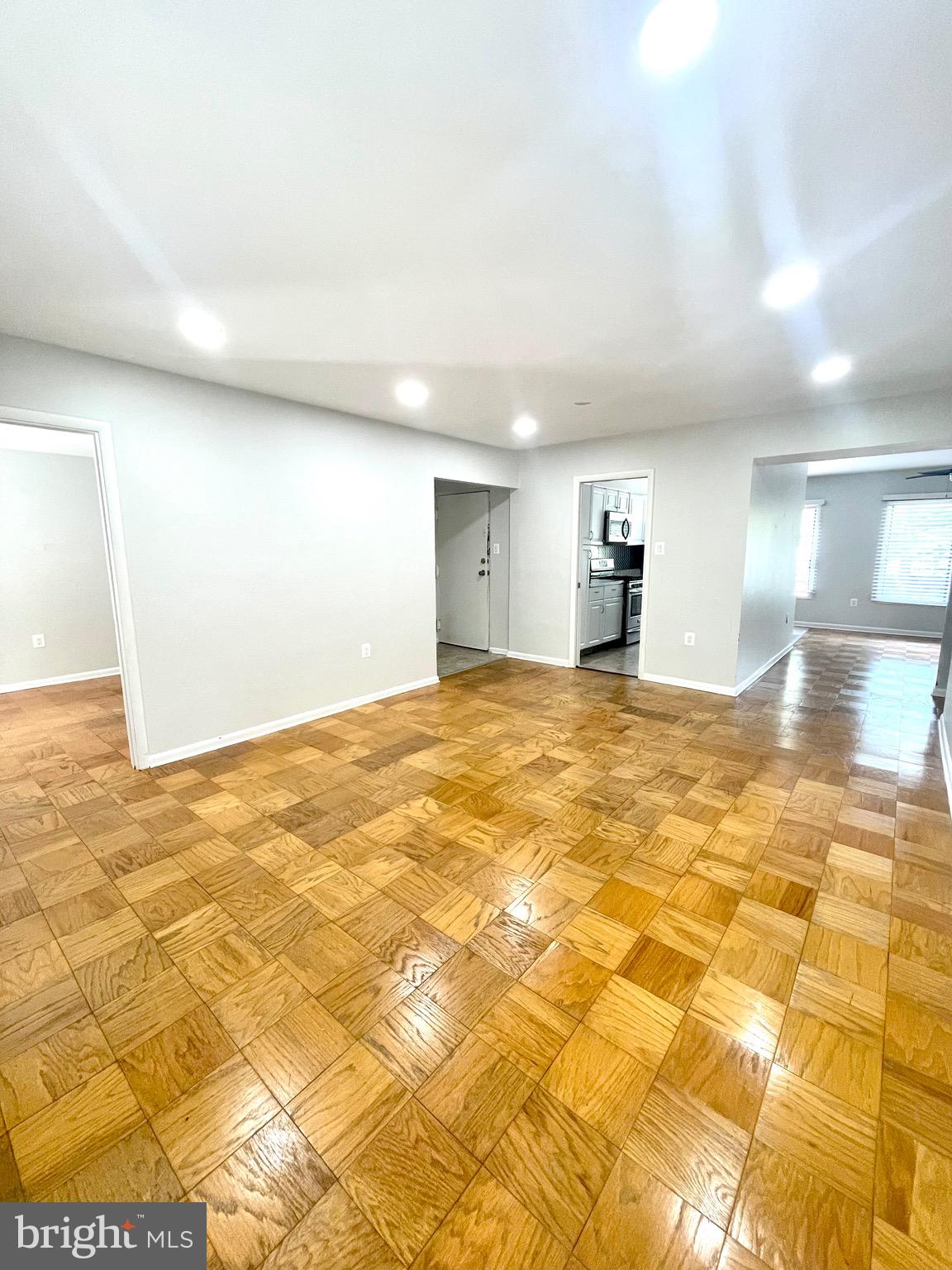 5234 West Running Brook Road, Unit 301 Columbia, MD 21044 - Photo 5 of 13 a view of empty room with wooden floor