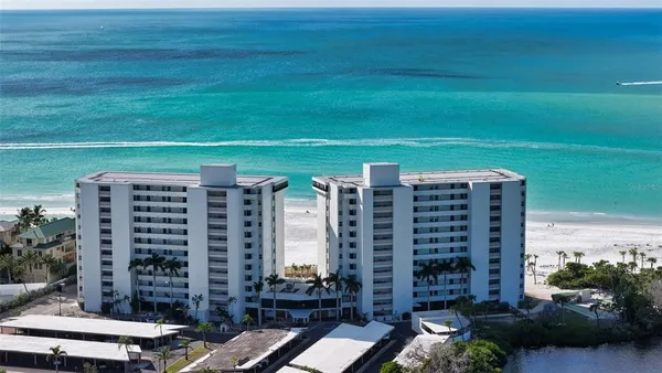 a view of a large building with a yard