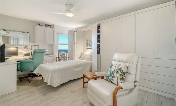 a view of a room with wooden floor