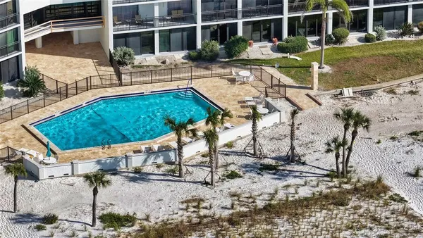 a view of a swimming pool with a patio