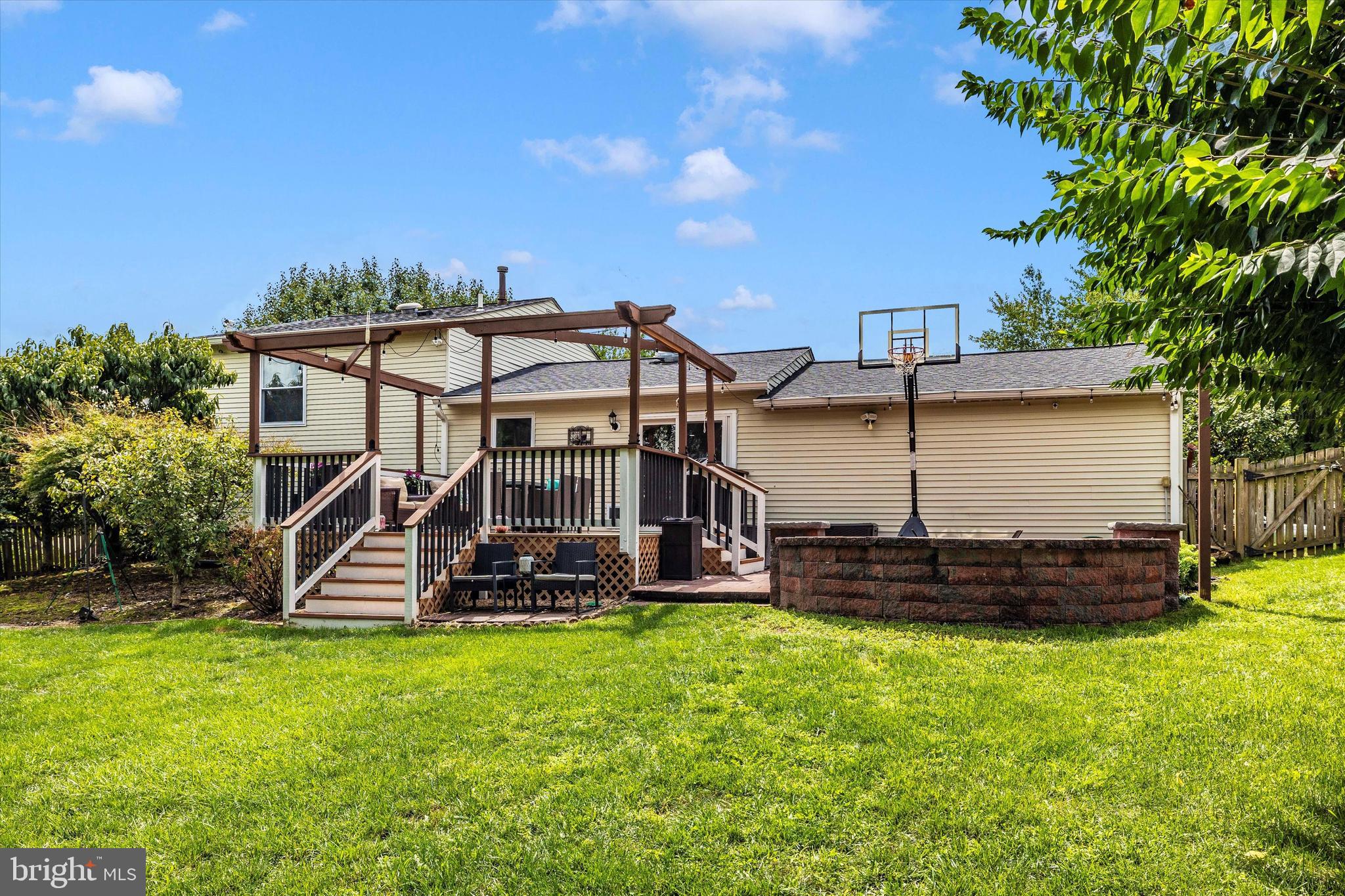 10319 Bloom Drive Damascus, MD 20872 - Photo 31 of 42 Custom deck and hardscaped fire pit area