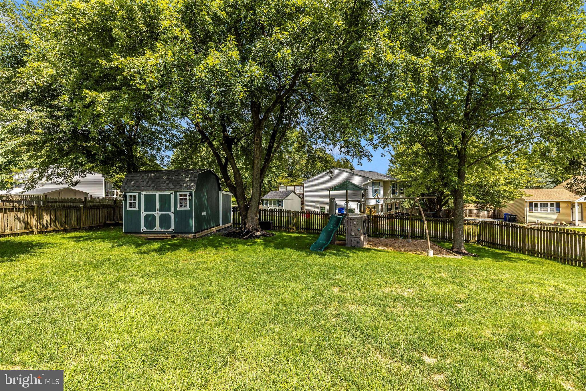 10319 Bloom Drive Damascus, MD 20872 - Photo 33 of 42 Shed and playset in back yard