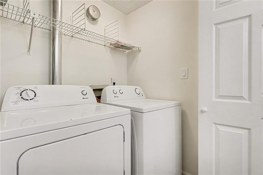 106 Ivy Green Lane Southeast Marietta, GA 30067 - Photo 12 of 20 a utility room with dryer and washer
