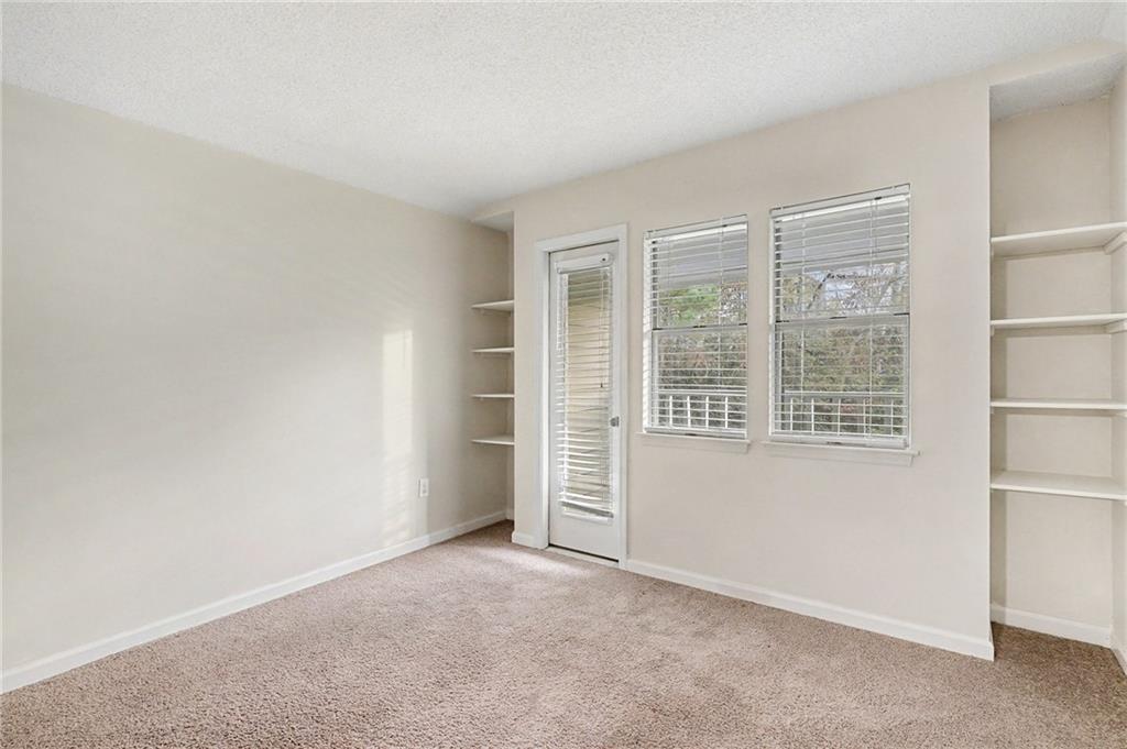 106 Ivy Green Lane Southeast Marietta, GA 30067 - Photo 17 of 20 an empty room with windows