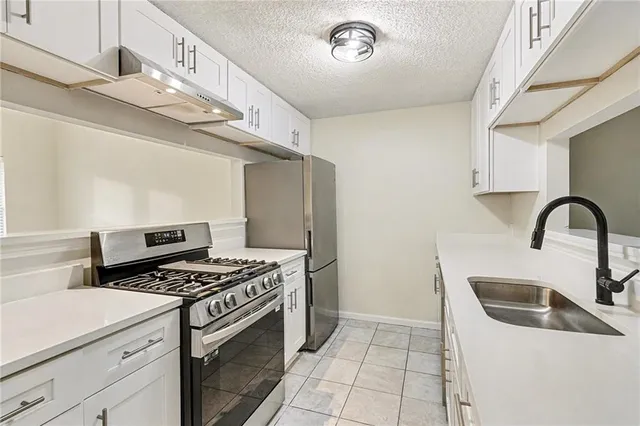 a kitchen with a stove and a sink