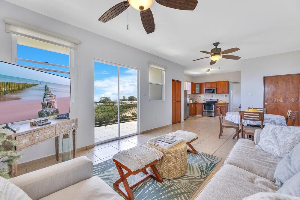 413 Camino Carretas, Unit A7 Rincon, Rincón 00677 - Photo 5 of 23 a living room with furniture and a window