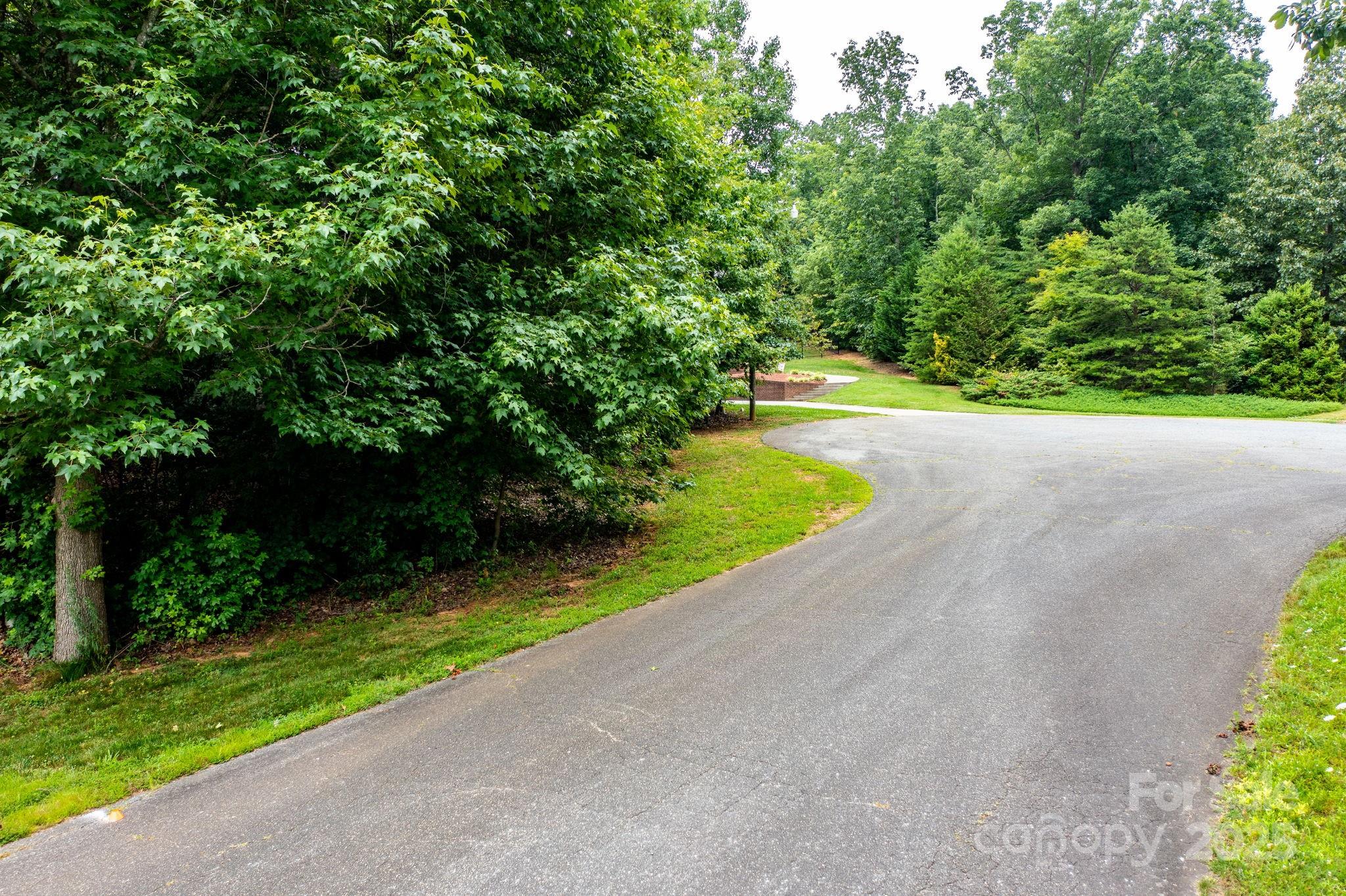 351 I-40 Access Road Hildebran, NC 28637 - Photo 20 of 36 a view of a patio with plants and large trees