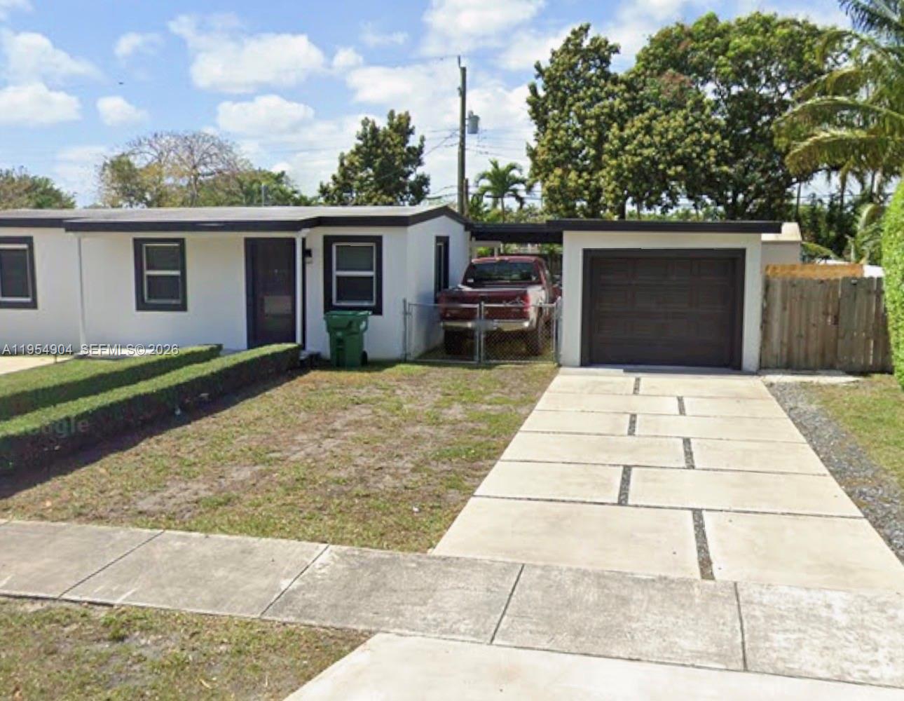 a view of a backyard of the house