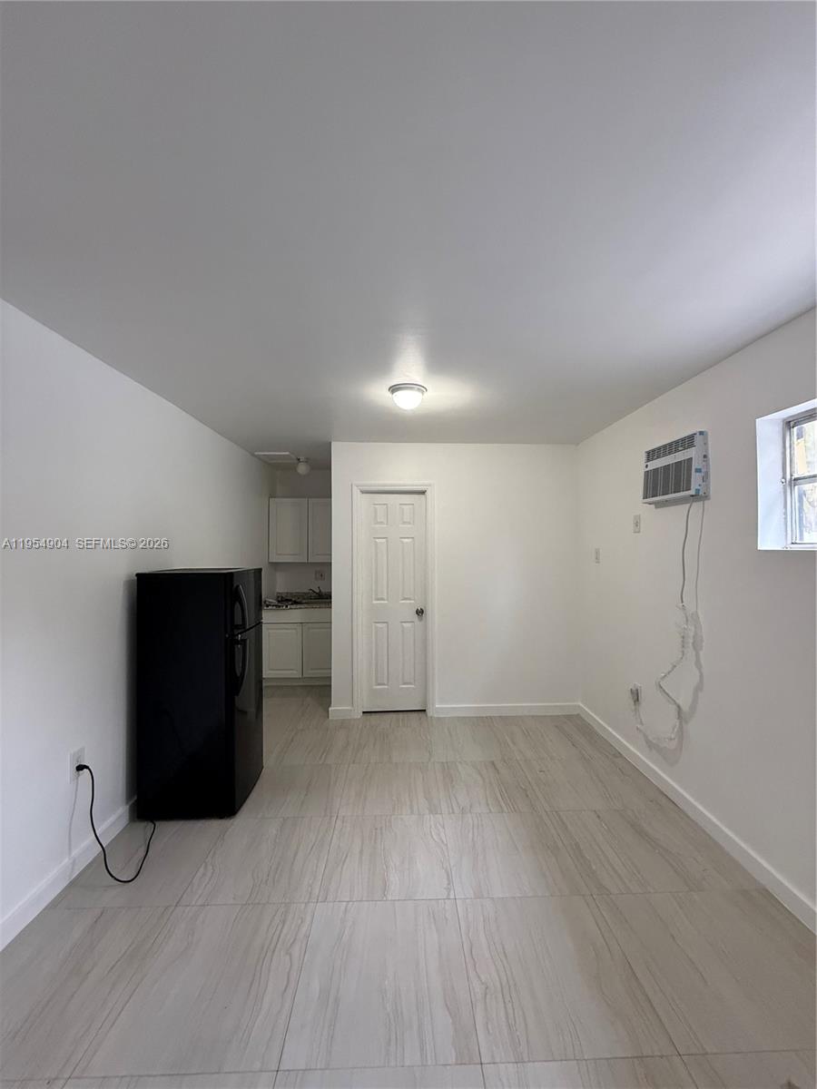 4910 Southwest 98th Avenue Road, Unit A Miami, FL 33165 - Photo 4 of 8 wooden floor in an empty room