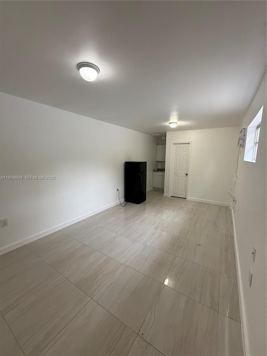 4910 Southwest 98th Avenue Road, Unit A Miami, FL 33165 - Photo 5 of 8 a view of an empty room