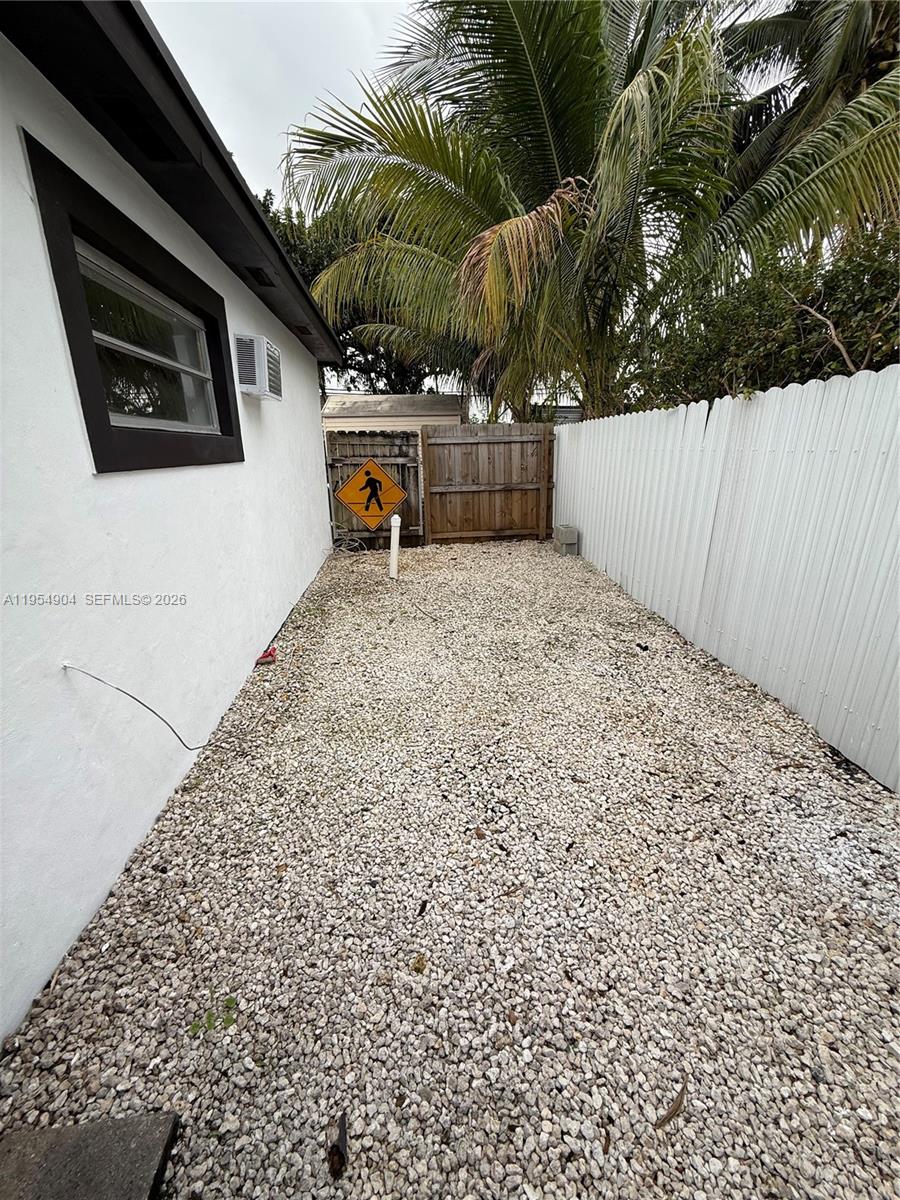 4910 Southwest 98th Avenue Road, Unit A Miami, FL 33165 - Photo 8 of 8 a backyard of a house with lots of green space