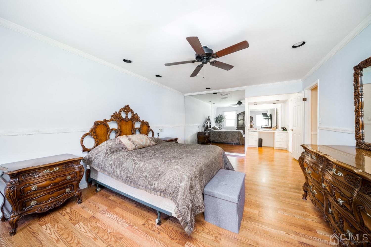 465 Cottrell Road Old Bridge, NJ 08857 - Photo 14 of 45 a bedroom with a bed and wooden floor