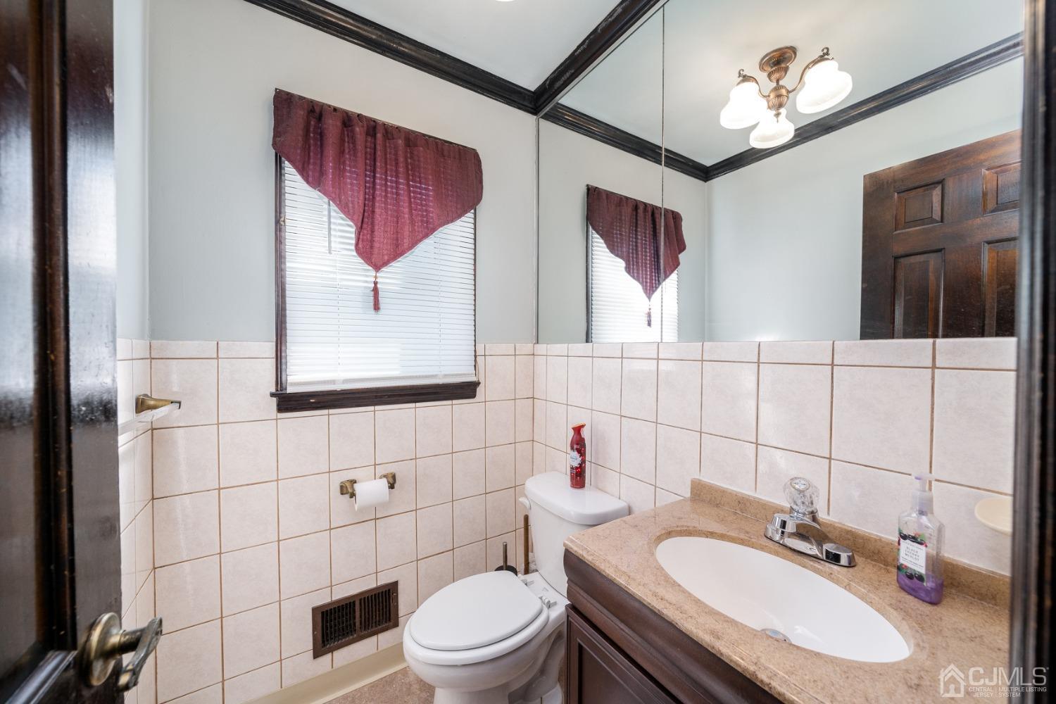 465 Cottrell Road Old Bridge, NJ 08857 - Photo 18 of 45 a bathroom with a toilet sink and mirror