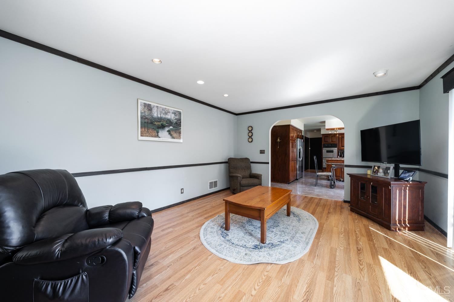 465 Cottrell Road Old Bridge, NJ 08857 - Photo 23 of 45 a living room with furniture and a flat screen tv