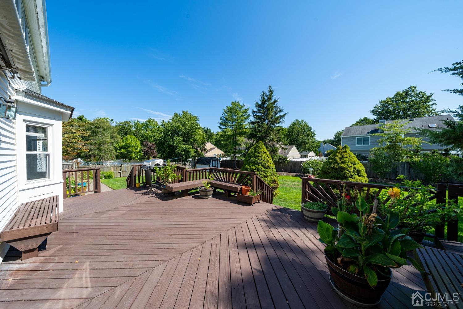 465 Cottrell Road Old Bridge, NJ 08857 - Photo 25 of 45 a view of a chairs and table on the wooden deck