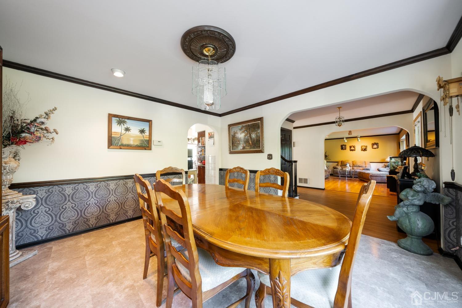 465 Cottrell Road Old Bridge, NJ 08857 - Photo 5 of 45 a dining room with furniture and a chandelier