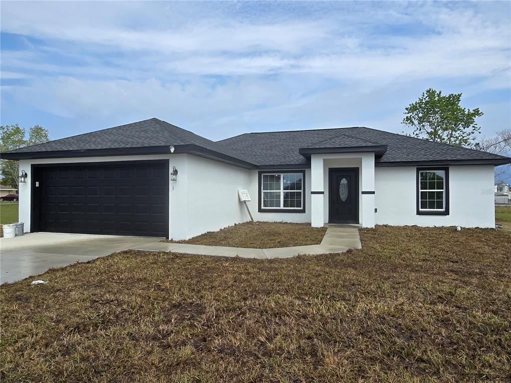 17 Laurel Pass Ocala, FL 34480 - Photo 1 of 1 a house with yard in front of it