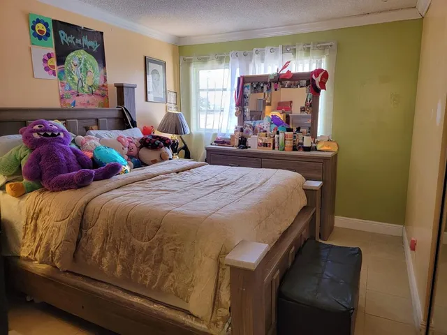 a bed room with two bed and a large mirror