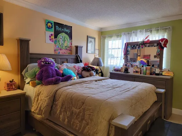 a bedroom with a bed and window