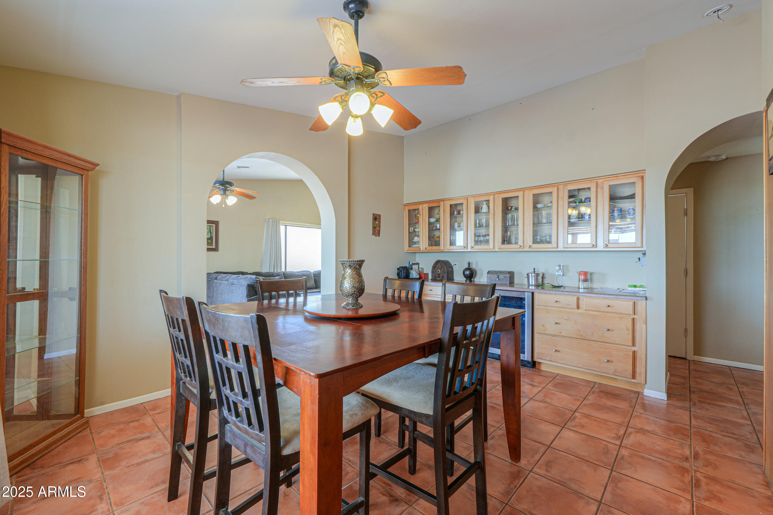 209 South Hidden Valley Road Maricopa, AZ 85139 - Photo 11 of 39 a dining room with furniture and window