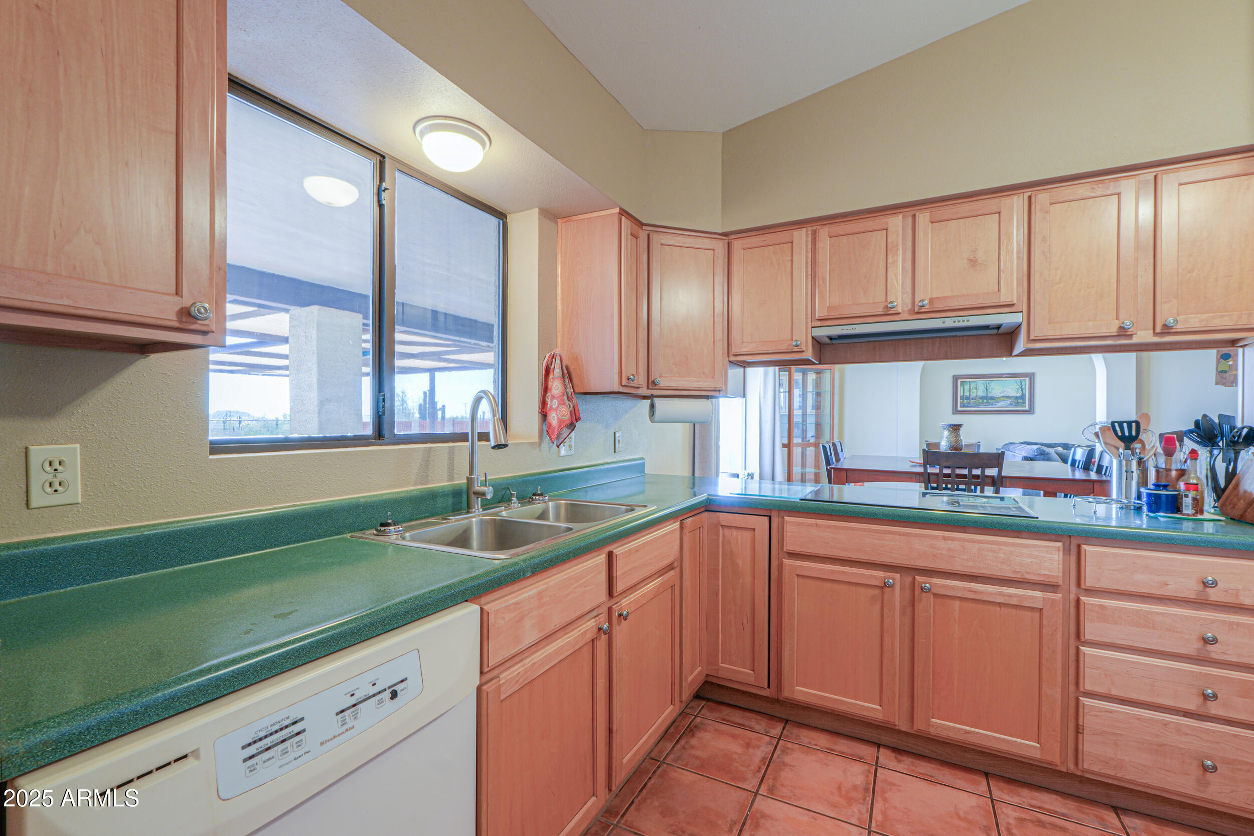 209 South Hidden Valley Road Maricopa, AZ 85139 - Photo 14 of 39 a kitchen with sink cabinets and window