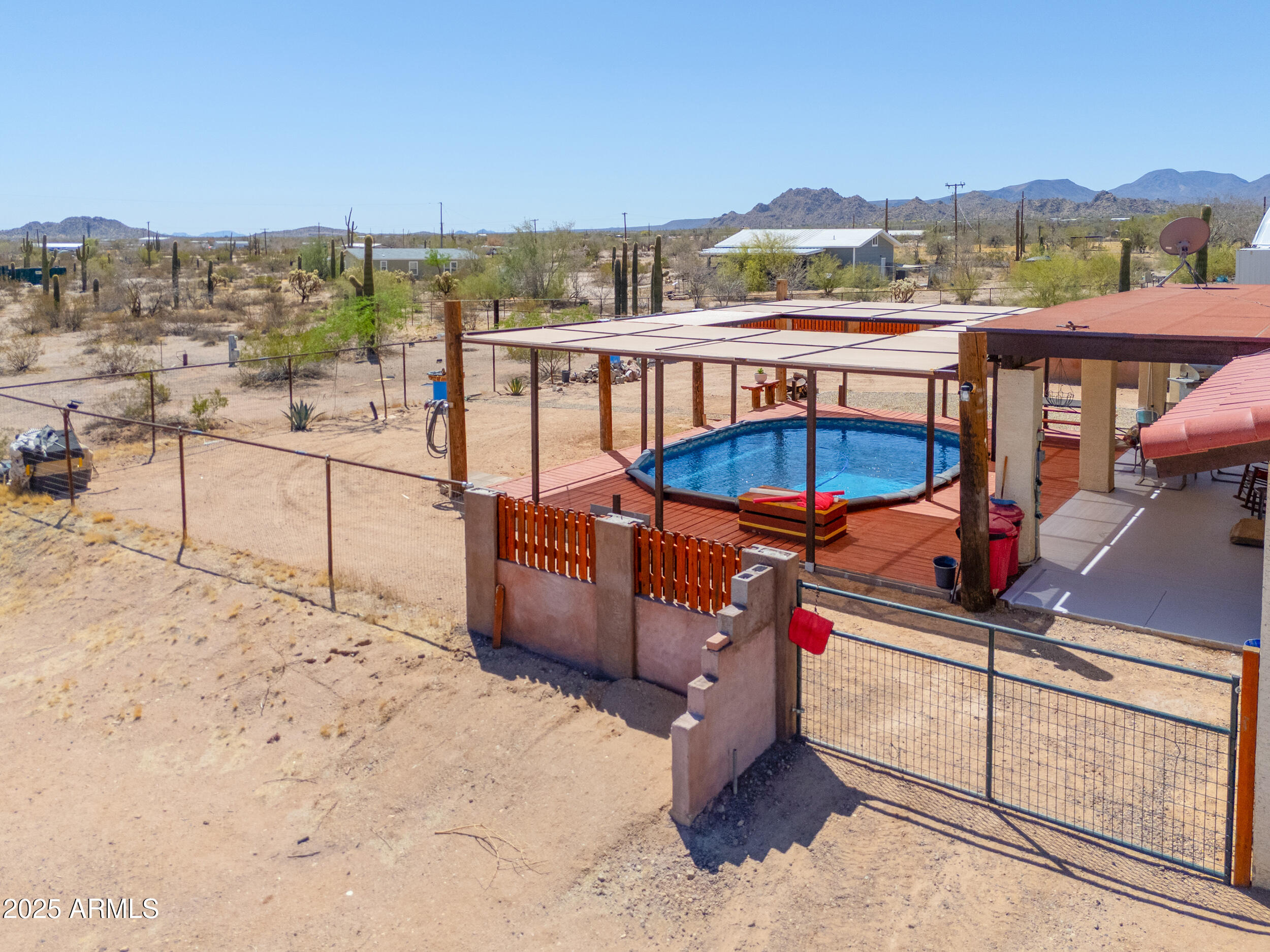 209 South Hidden Valley Road Maricopa, AZ 85139 - Photo 32 of 39 a view of a balcony with chairs