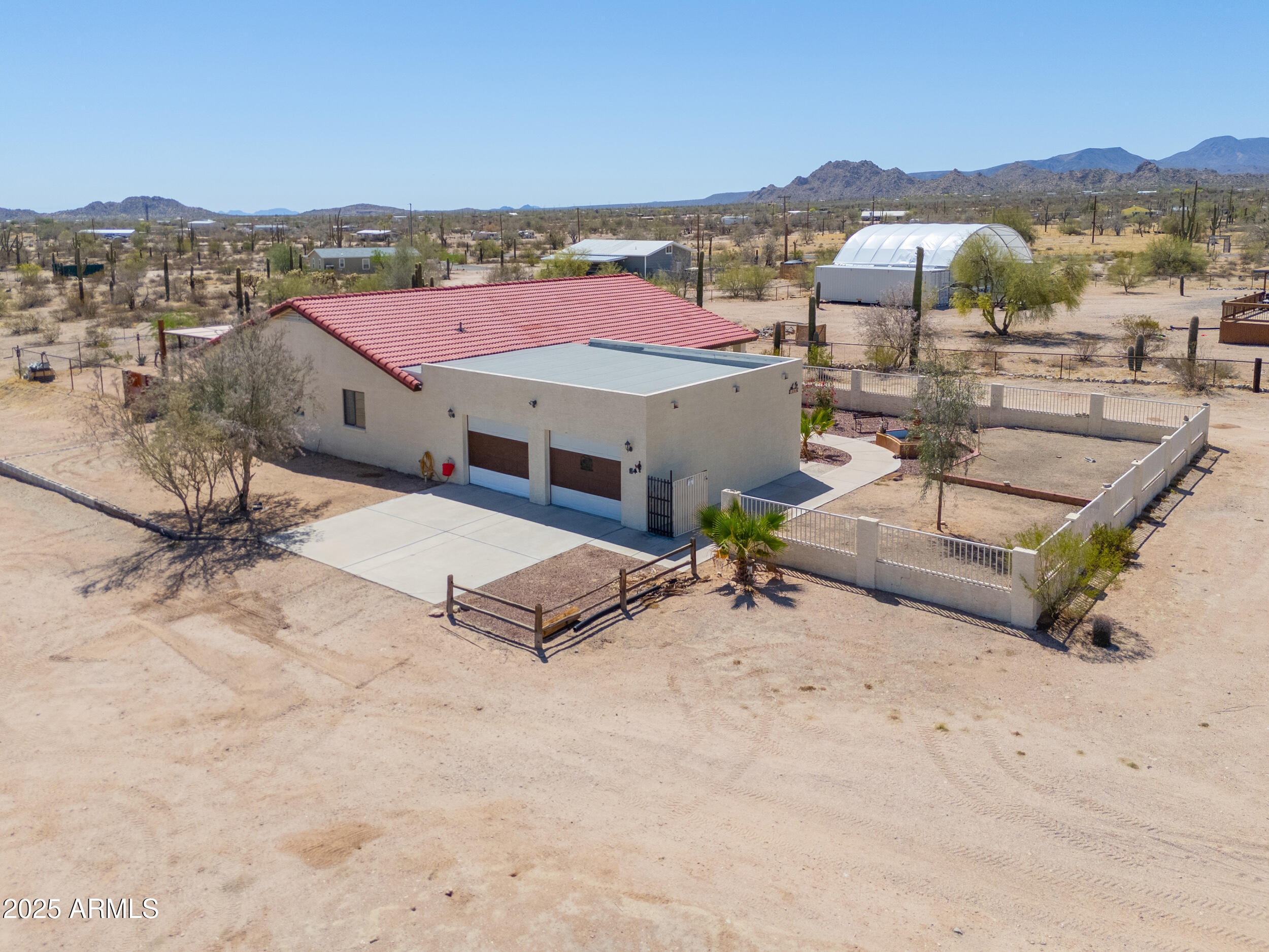 209 South Hidden Valley Road Maricopa, AZ 85139 - Photo 3 of 39 an aerial view of residential houses with outdoor space