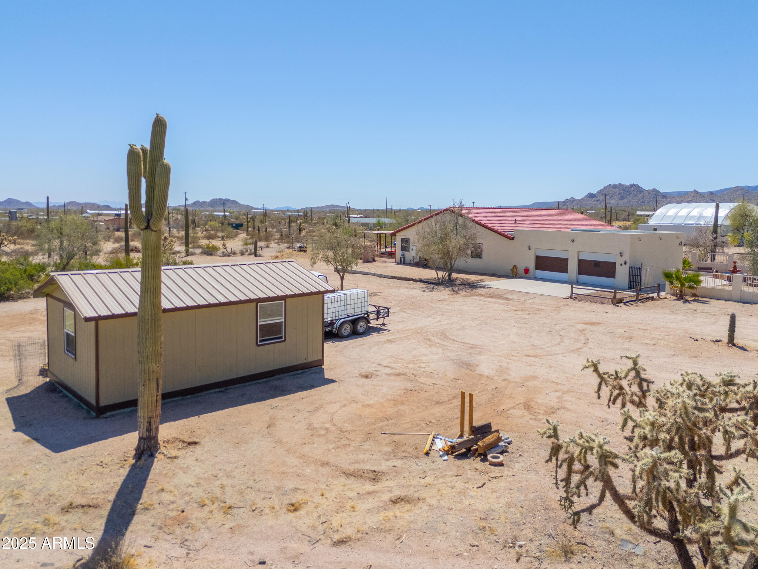 209 South Hidden Valley Road Maricopa, AZ 85139 - Photo 4 of 39 a view of a terrace with a barbeque