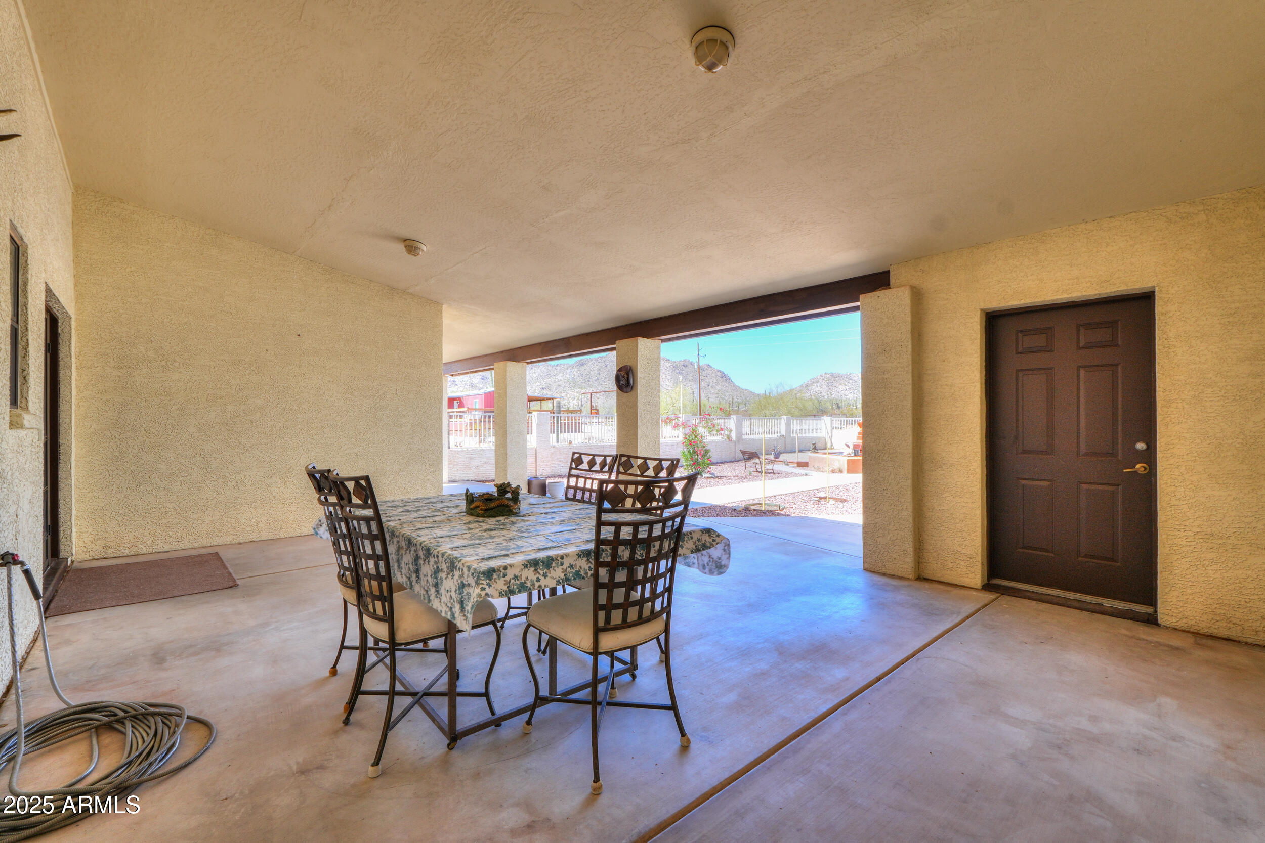 209 South Hidden Valley Road Maricopa, AZ 85139 - Photo 6 of 39 a view of a dining room with furniture and wooden floor