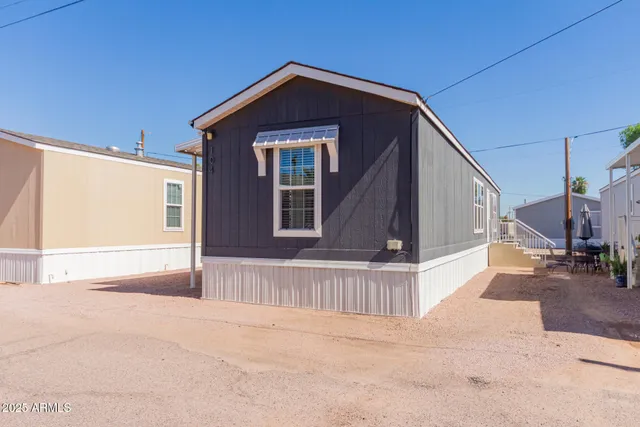 a view of a house with a small yard