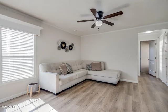 a living room with furniture and a window